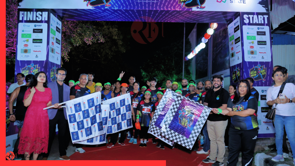 Runners in neon gear dash through illuminated tunnels at Delhi Neon Run 2025, Omaxe State Dwarka.